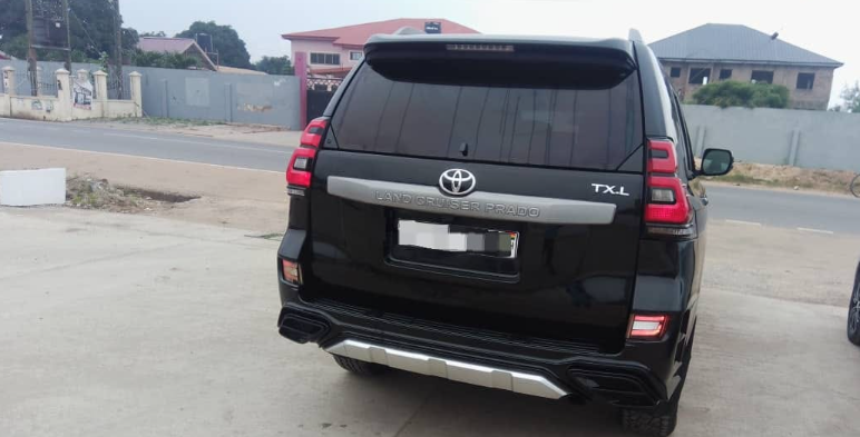 back of metalic black car